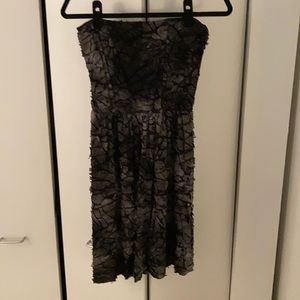 Black “scaled” strapless Aleya dress.